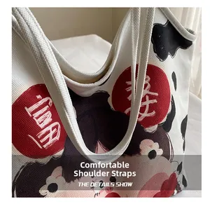 Close-up of the comfortable canvas shoulder strap on the cow print tote bag detail