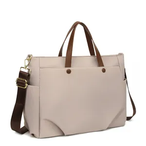 Minimalistische beige laptoptas voor dames met bruine handvatten en schouderriem