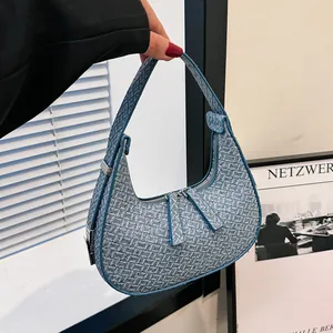 Elegante blauwe jacquard halve maan onderarmtas met dubbele rits en geweven textuur