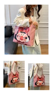 Close-up of pink canvas tote bag featuring original artistic girl illustration