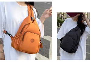 Detail of orange and black nylon crossbody chest bags with multi-layer zippers and side pockets