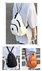 Three colors of waterproof nylon sling bags with multiple zippers and adjustable straps