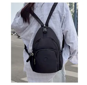 Close-up of black nylon multi-functional backpack with durable zipper layers and round logo