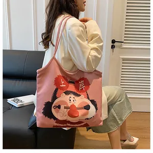 Pink canvas tote bag featuring cute cartoon girl illustration and sturdy shoulder straps
