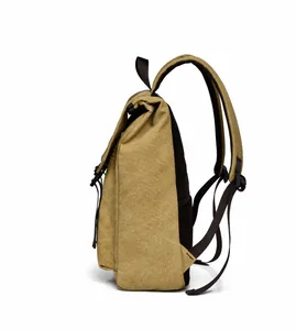Side view of khaki canvas backpack showing breathable mesh straps and buckle flap