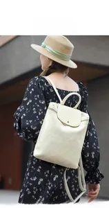 Creamy white quilted backpack for women shown on model for daily urban street style
