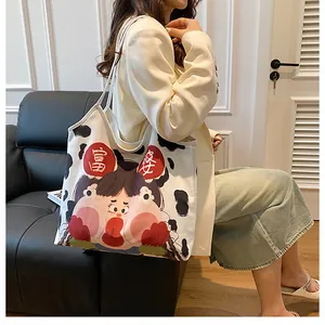 Close-up of cow pattern canvas tote bag with funny cartoon character and rich lady text