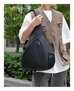 Close-up of black waterproof nylon crossbody chest bag with mesh side pocket and zipper details