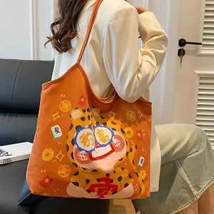 Orange canvas tote bag with cartoon leopard and lucky symbols for daily use