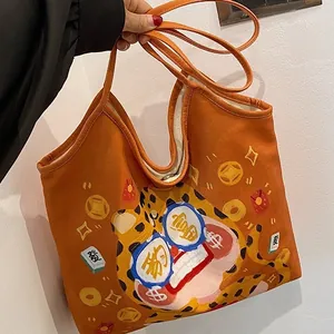 Original canvas tote bag featuring orange cartoon lion and mahjong pattern design