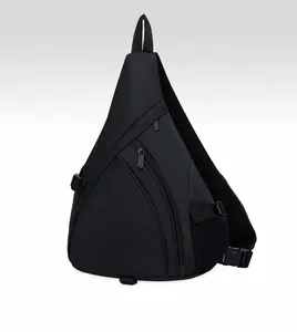 Detail view of black nylon sling bag showing side mesh pocket and adjustable buckle
