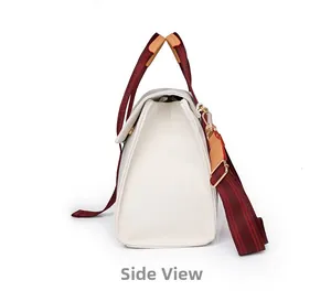 Side view detail of white canvas tote with red-brown striped handles and metal hooks