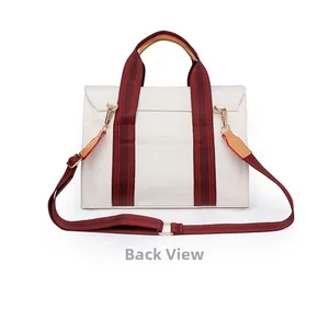 Back view of cream canvas tote bag showing hidden pocket and red striped straps