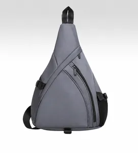 Front view of dark grey triangular crossbody bag with asymmetric zipper and mesh pocket