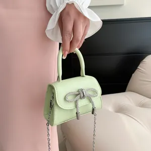 Mint green mini crossbody bag with rhinestone bow and silver chain for girls and women