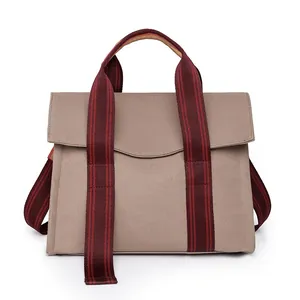 Large capacity canvas tote bag with khaki fabric and red-brown striped shoulder straps