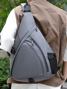 Waterproof dark grey crossbody sling bag with multiple compartments for outdoor activities