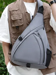 Gray triangle chest bag with fabric texture and side mesh pocket worn across the chest