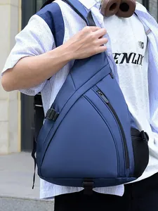 Fashionable blue triangular chest bag with adjustable strap shown on a model