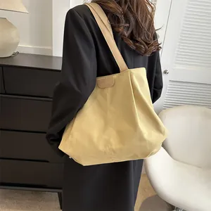French-style canvas tote bag in mustard yellow for daily commute with shoulder strap