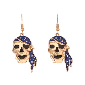 Gothic pirate skull earrings in gold alloy with blue starry enamel headscarf
