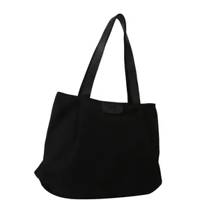 Minimalist large capacity black canvas tote bag with fashion leather patch for daily commuting