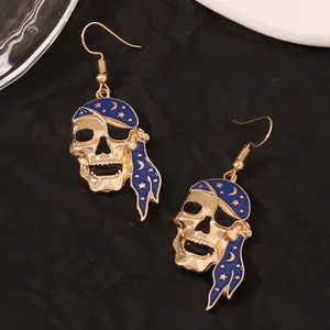 Gothic pirate skull drop earrings in gold alloy with blue moon star headscarf details