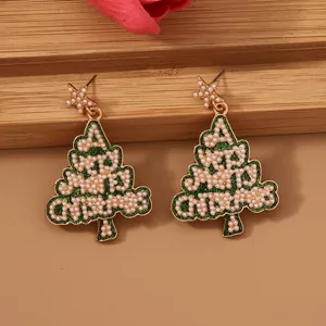 Christmas tree alloy earrings with green glitter, pearls spelling MERRY, and gold stars