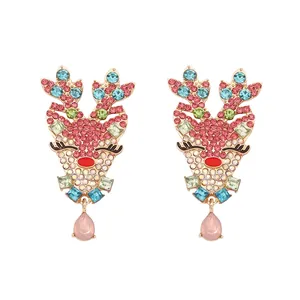 Vintage gold-plated reindeer earrings with colorful rhinestones and pink teardrop