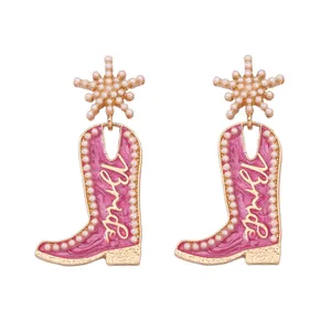 Boucles d'oreilles bottes de cow-boy roses avec perles et design étoile dorée