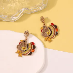 Sparkly Thanksgiving turkey dangle earrings with multi-color rhinestones on gold base