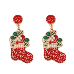 Festive Christmas stocking earrings with red rhinestones and white pearls in gold setting