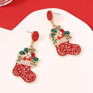 Detail of Christmas stocking drop earrings with red rhinestones and white pearls