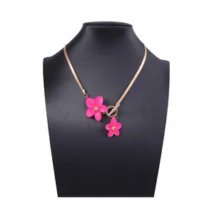 Elegant gold snake chain necklace with pink flower pendants and OT toggle clasp