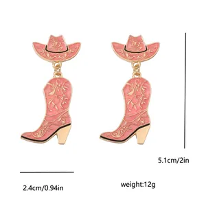 Detail showing pink western cowboy hat and boot earrings with size measurement labels