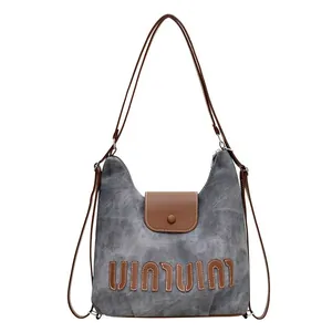 Chic gray canvas and brown leather tote backpack with large capacity and vintage design