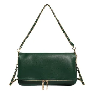 Classic dark green pebble leather shoulder bag with gold chain strap and zipper detail