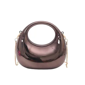 Mini crescent evening bag in brown metallic acrylic with gold chain strap