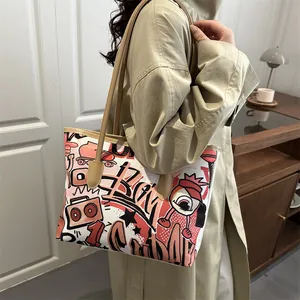 Fashionable graffiti canvas tote bag with brown leather straps and colorful art prints
