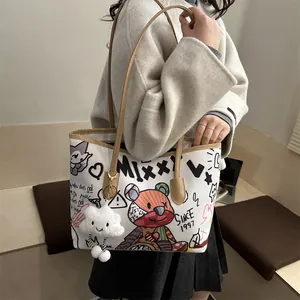 Canvas shoulder tote bag with bear graffiti and brown leather trim for women