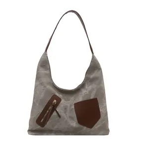 Retro grey canvas tote bag with brown leather details and shoulder straps for women