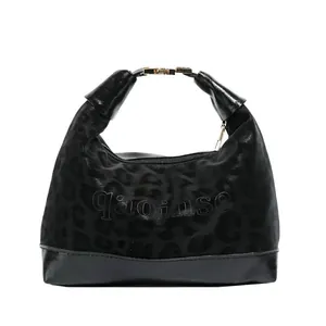 Fashionable black hobo bag with leopard texture and gold metal buckle on white background