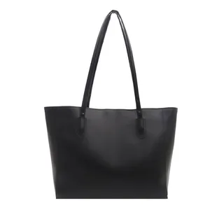 Minimalist black faux leather large tote bag for women with slim shoulder straps