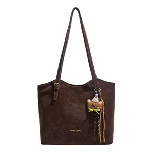 Retro dark brown matte tote bag with teddy bear charm and adjustable shoulder straps