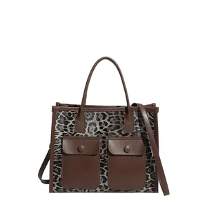 Retro leopard print tote bag with brown leather pockets and shoulder strap details