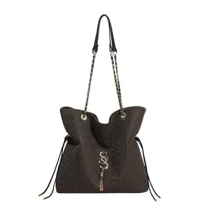 Sparkly dark bronze tote bag with gold chain strap, metal logo and stylish tassels