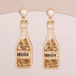 Elegante Sektflaschen-Ohrringe mit Perlen und Kristallen mit dem Schriftzug BRIDE
