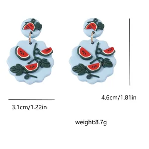 Detail view of watermelon earrings with dimensions 3.1cm x 4.6cm and weight 8.7g