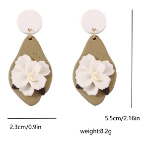 Detailed view of handmade olive green teardrop clay earrings with size measurements