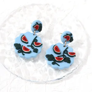 Summer watermelon dangle earrings with blue wave base and gold metal hooks